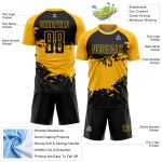 Aangepast zwart-gouden spatten sublimatie voetbaltenue-shirt Aangepast zwart-gouden spatten sublimatie voetbaltenue-shirt